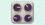 A duotoned dark purple and beige version of the Apple 'control knobs' emoji, in front of a light blue stripe background