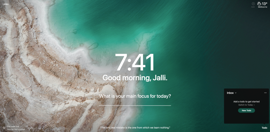 A screenshot of the Momentum browser extension showing a birdseye view photo of a sandy coast and green water, the current time, "Good morning, Jalli" and a question "What is your main focus for today?"