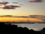 Photo of a glorious sunset of a cityscape seen from across a bay
