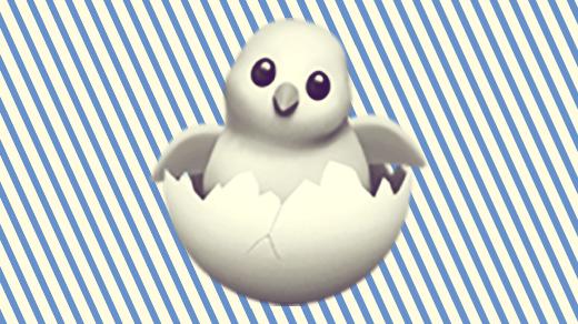A duotoned dark purple and beige version of the Apple hatching chick emoji, in front of a blue horizontal striped background